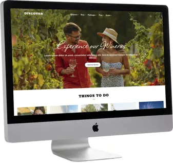 desktop computer with a tourism website on the screen